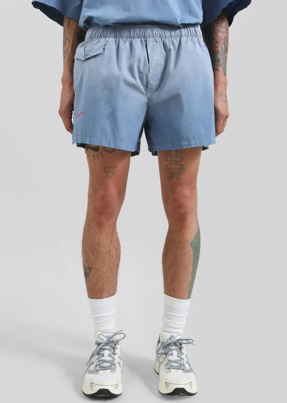 JW Anderson Logo Print Shorts - Light Blue