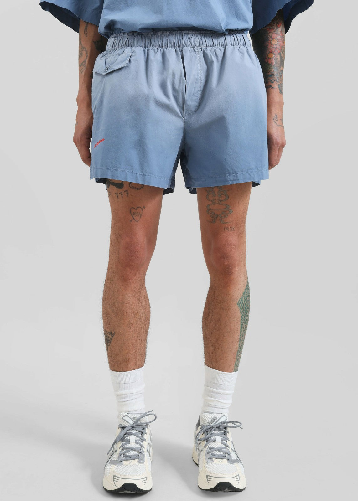JW Anderson Logo Print Shorts - Light Blue
