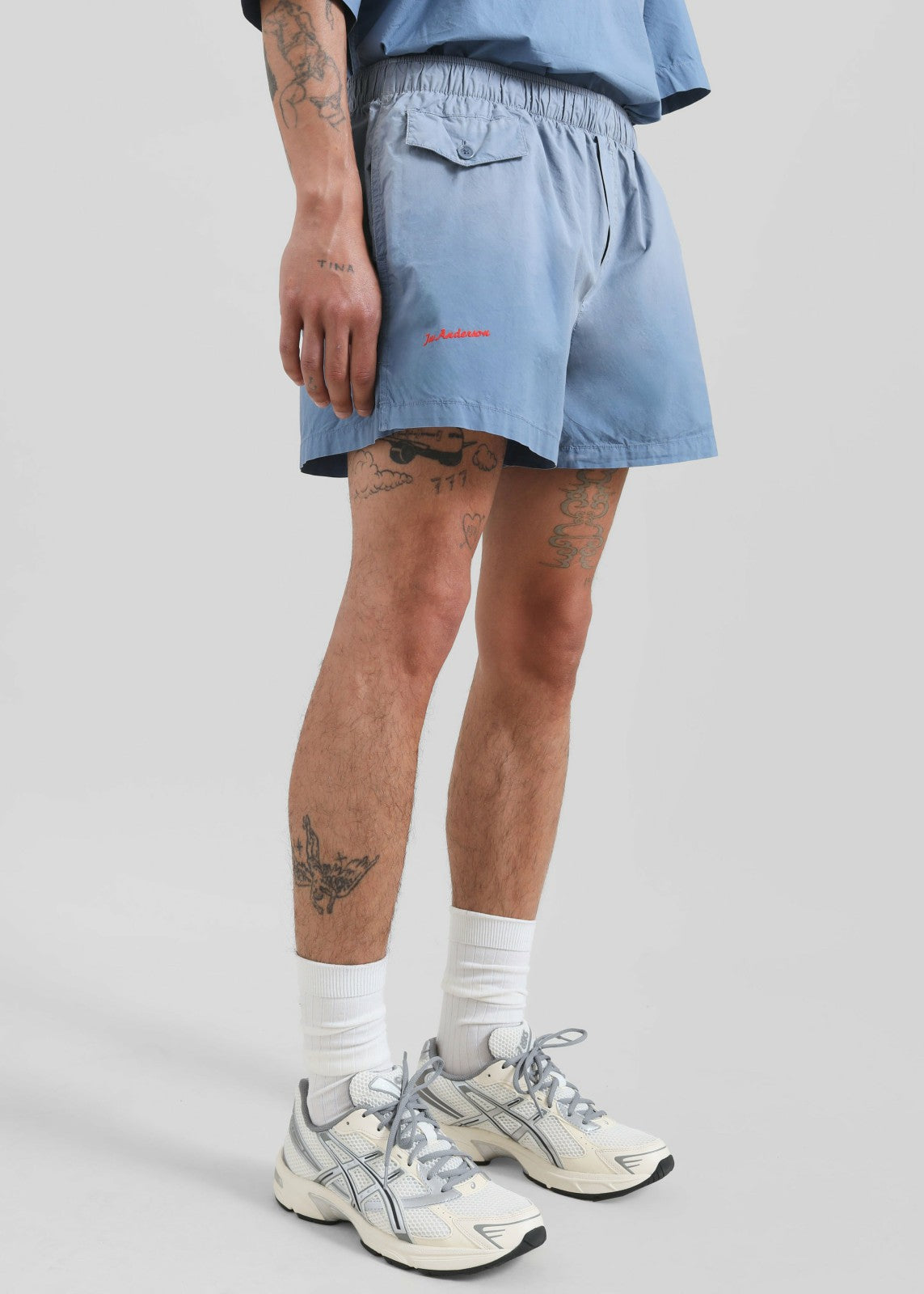 JW Anderson Logo Print Shorts - Light Blue