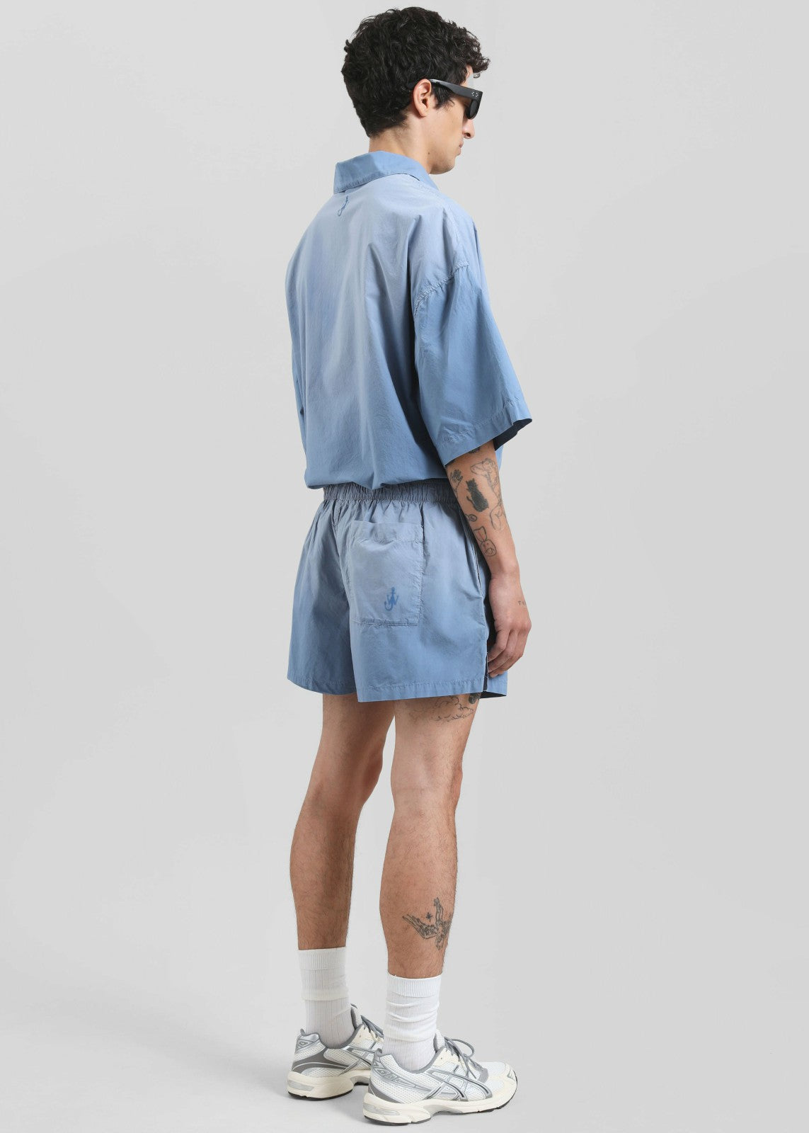 JW Anderson Logo Print Shorts - Light Blue